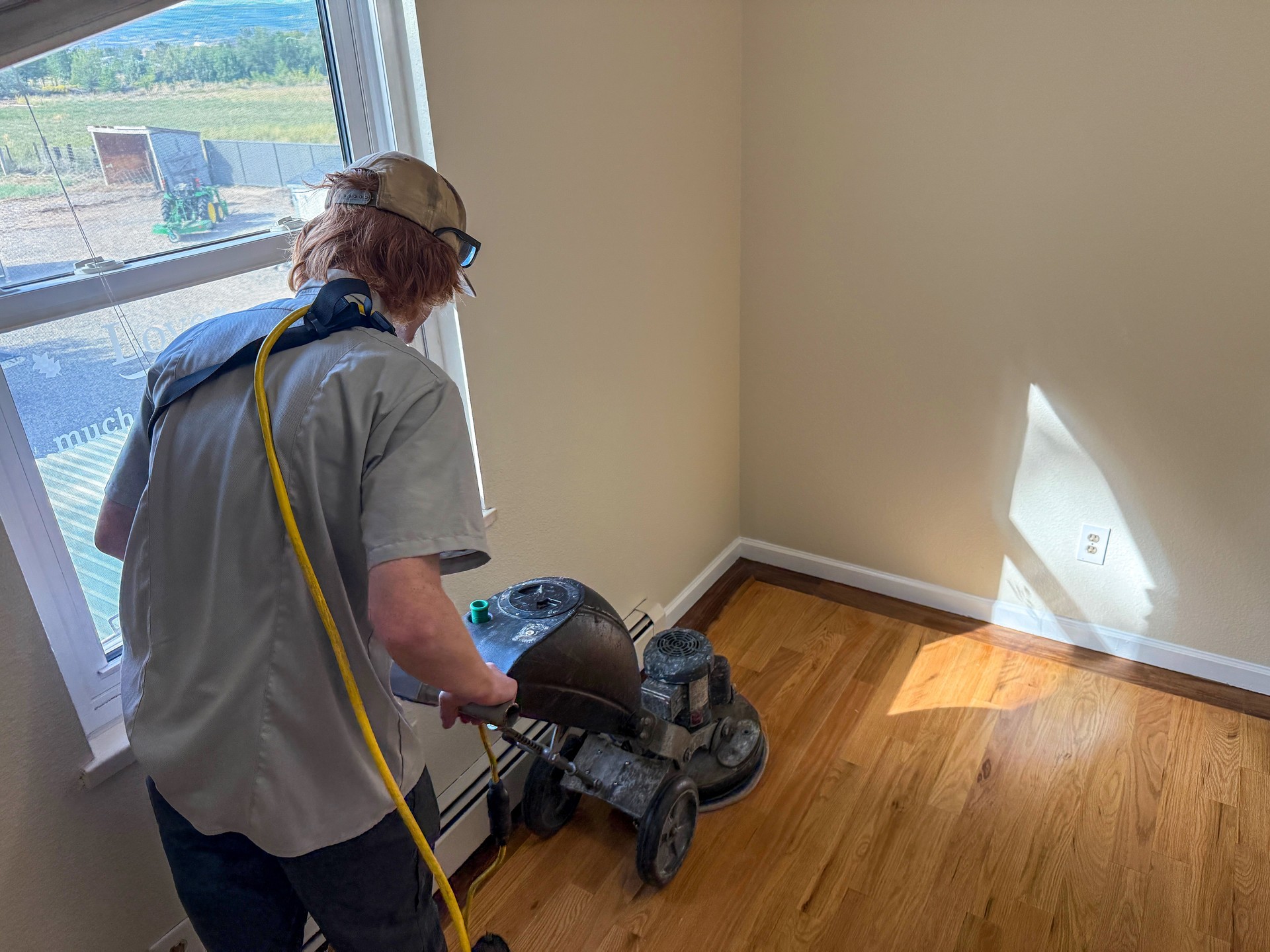 Professional Worker Buffing Hardwood Floor with Polishing Machine